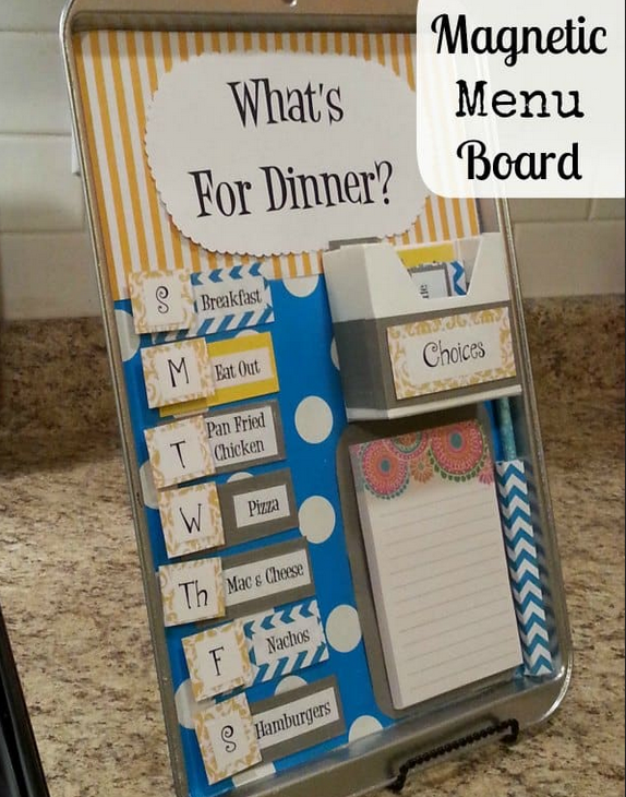 baking sheet decorated with colored paper and magnets
